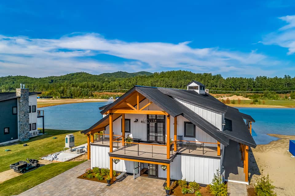 Modern waterfront house with wooden accents and private beach access