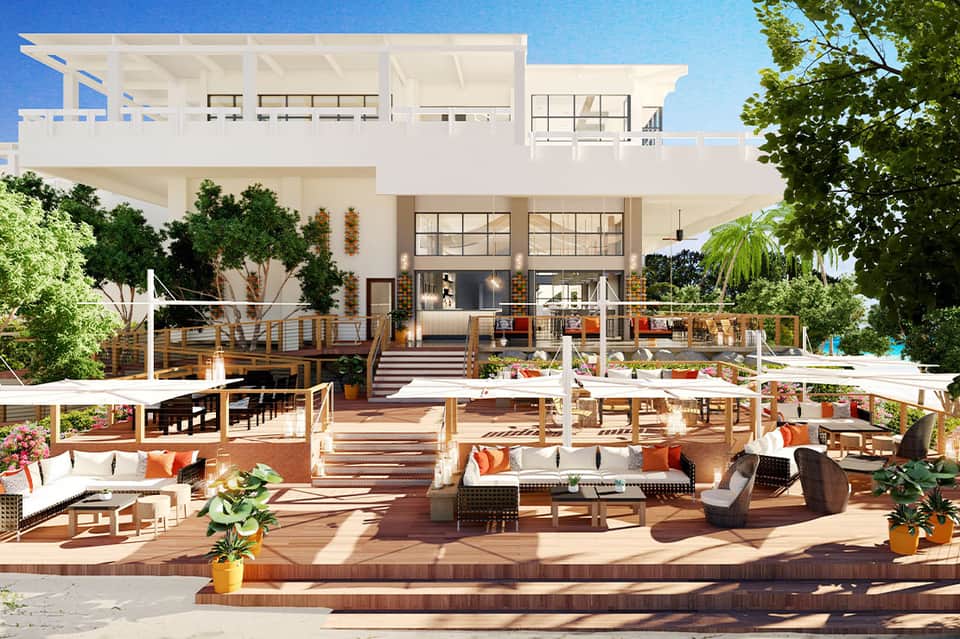 Modern luxury home exterior with multi-level deck, furniture, and landscaping