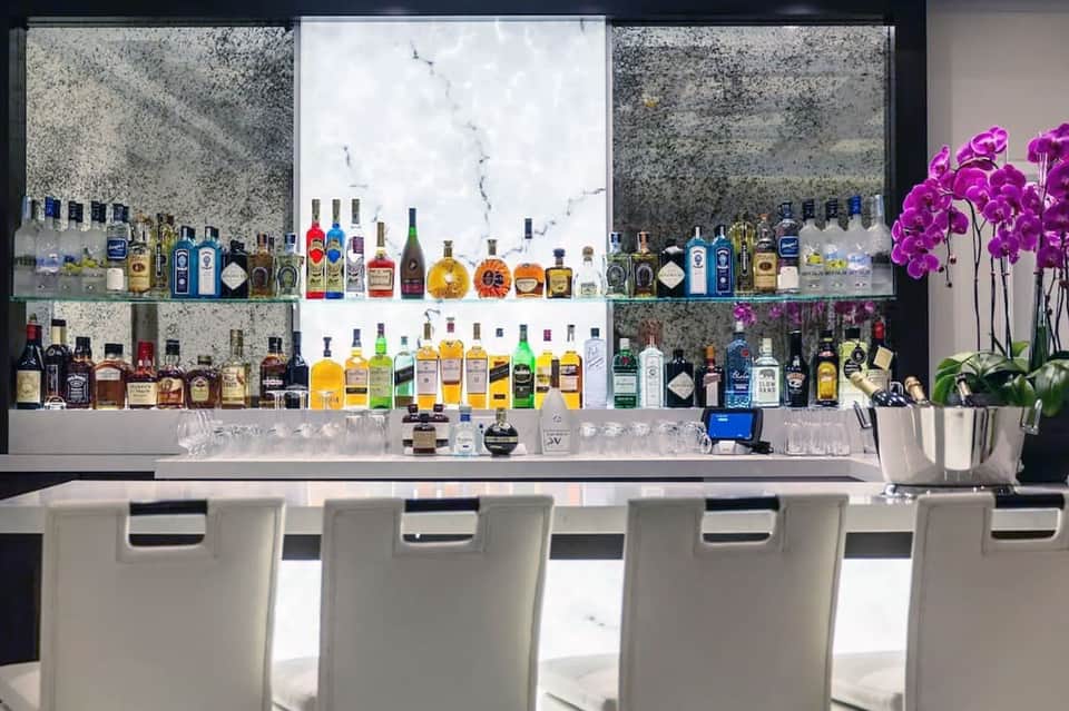 Upscale bar with extensive spirit collection and ambient lighting