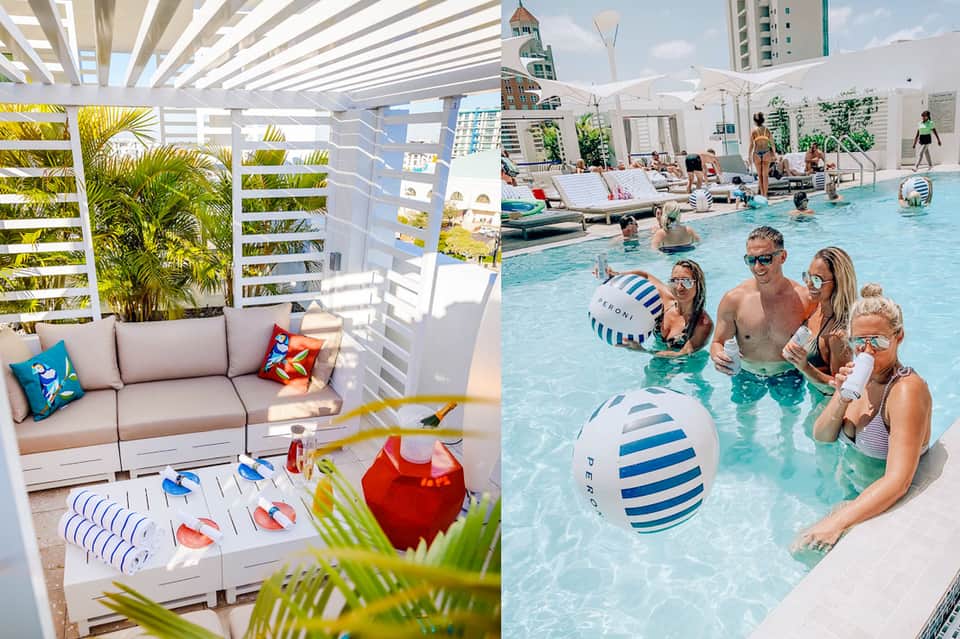 Rooftop pool deck with families swimming, lounge seating, white pergola, and city skyline views
