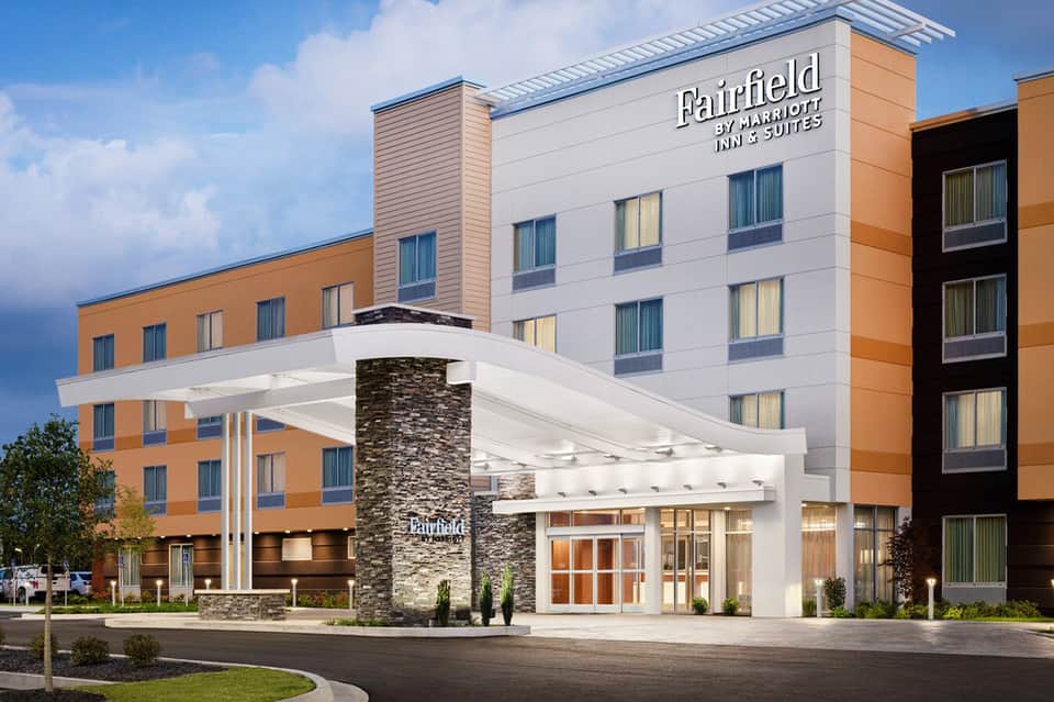 Fairfield by Marriott hotel entrance with modern architecture and stone accent column
