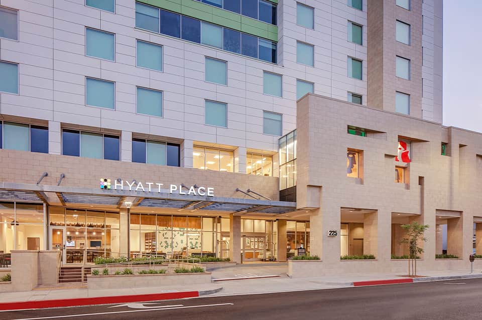 Hyatt Place hotel exterior at dusk with lit entrance and modern architecture