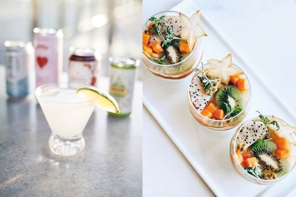 Cocktails and tropical fruit bowls displayed on white table at resort bar