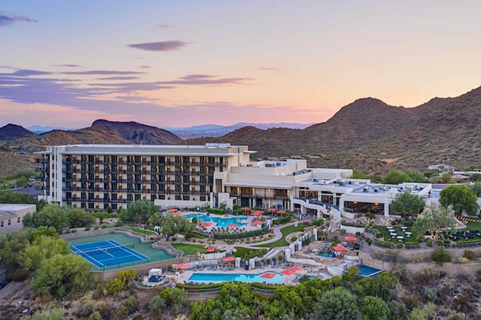Desert resort with multiple pools, spa facilities, and mountain backdrop