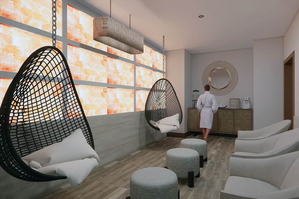 Modern spa relaxation room with hanging egg chairs and pendant lighting