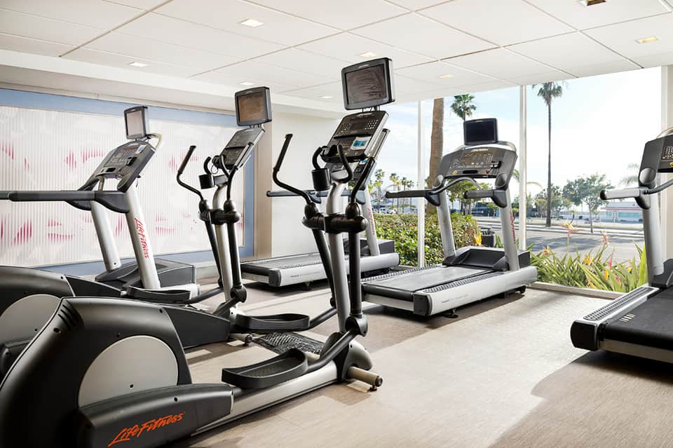 Fitness center with elliptical machines and ocean-view windows
