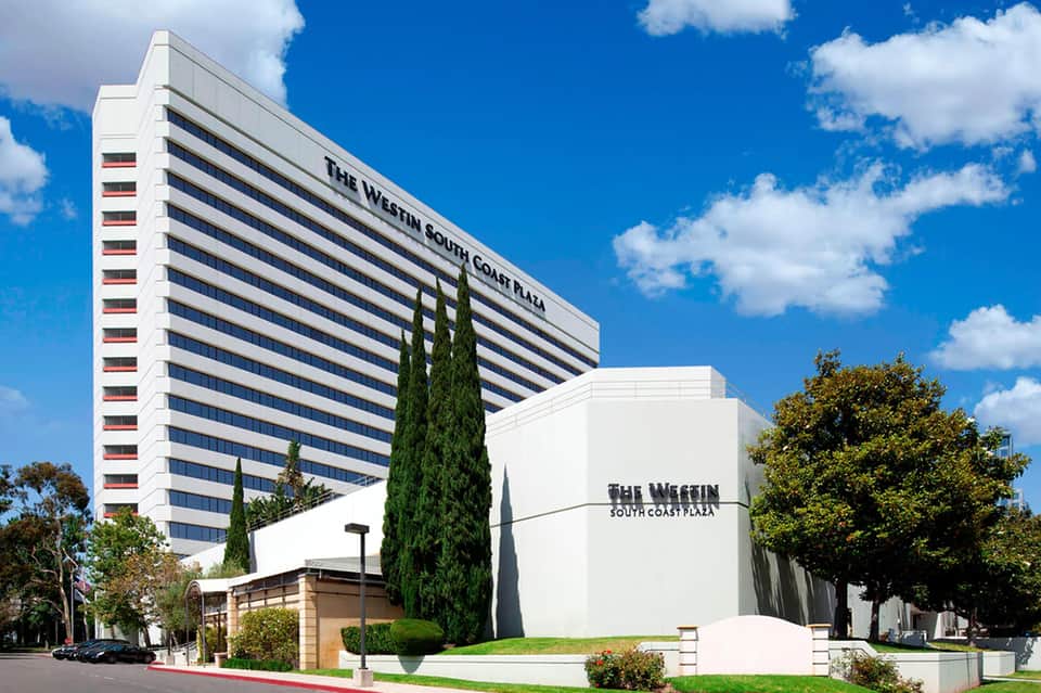 The Westin South Coast Plaza high-rise tower under blue sky with white building