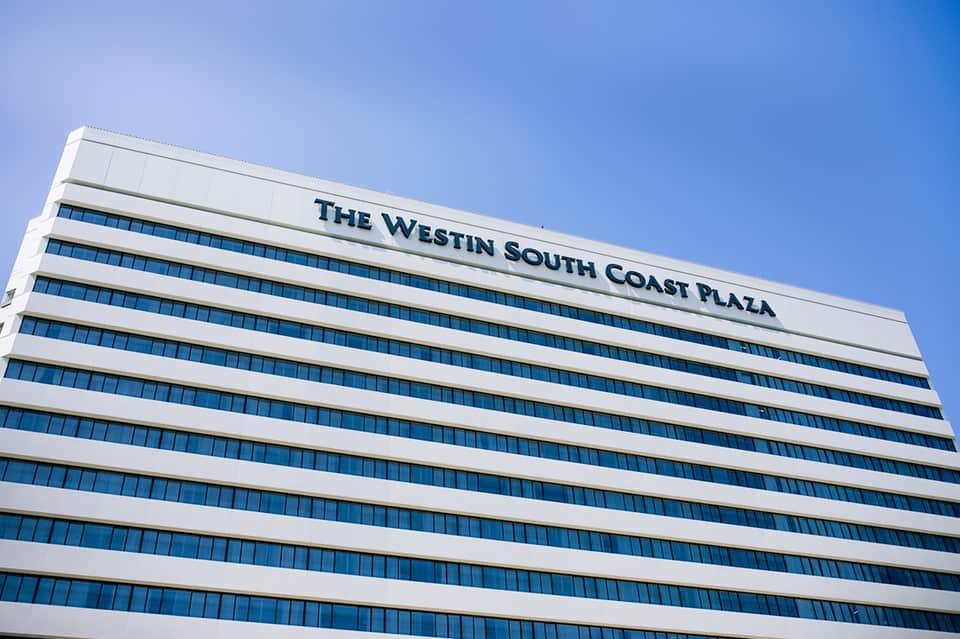 The Westin South Coast Plaza hotel building exterior with white facade and blue windows