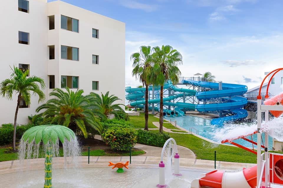 Resort grounds with water slides, splash pad, and landscaped outdoor space