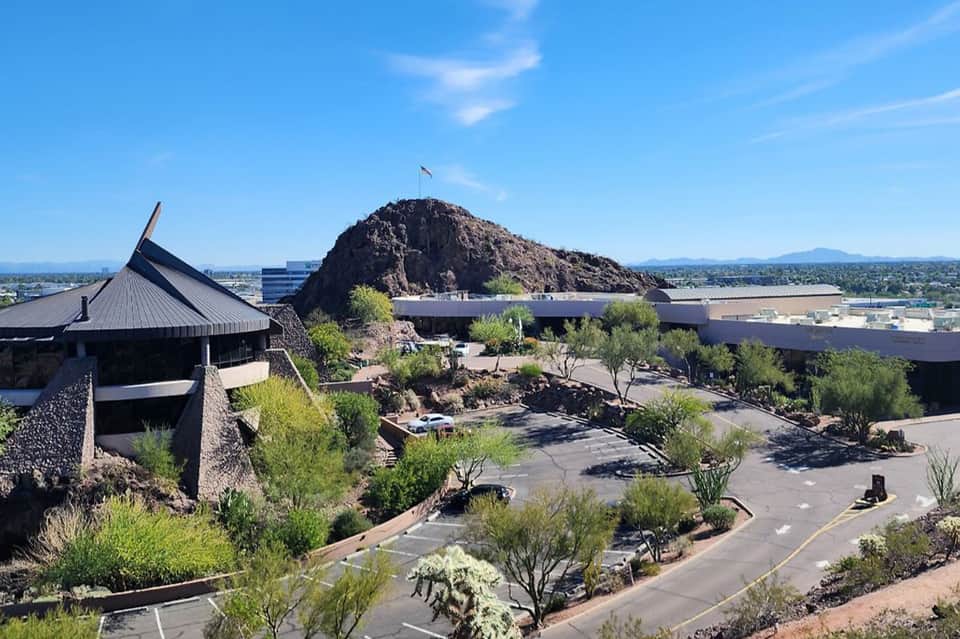 Desert museum campus with modern architecture, rocky hilltop, and landscaped grounds