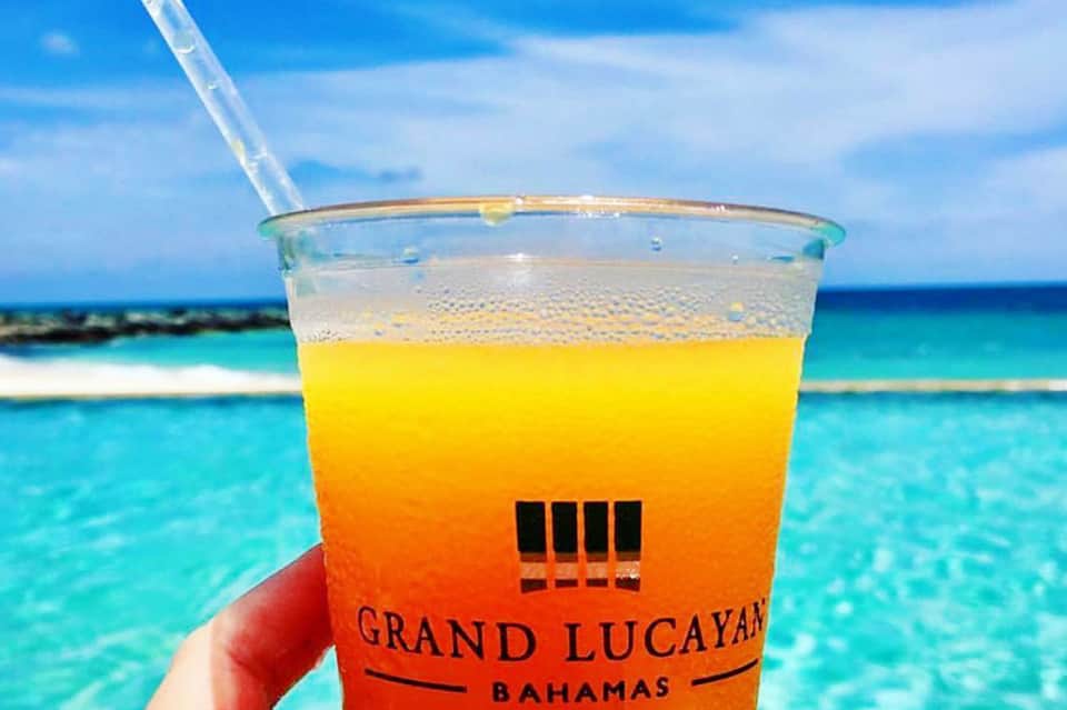 Colorful tropical drink at Grand Lucayan Bahamas overlooking turquoise ocean