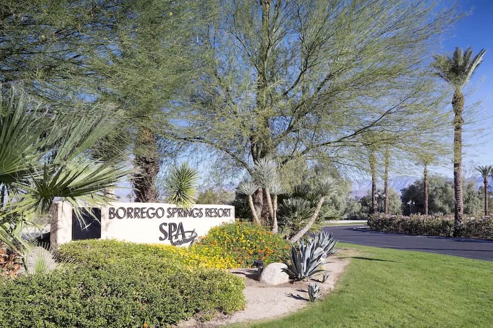 Borrego Springs Resort Spa entrance sign with desert landscaping and palm trees