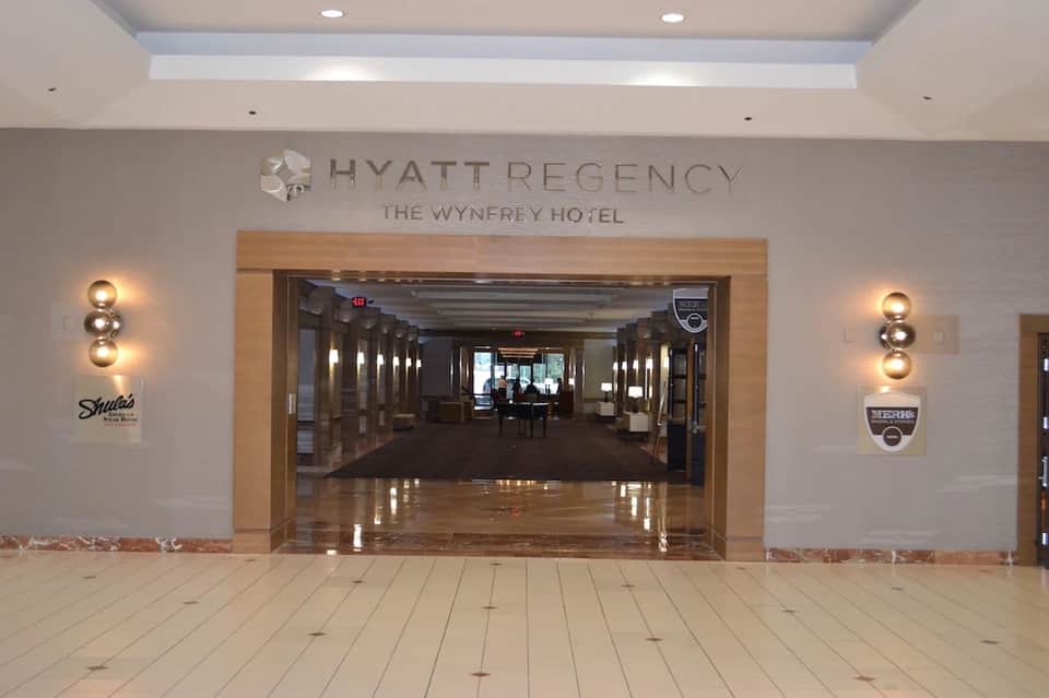 Hyatt Regency Wynfrey Hotel entrance with modern signage and polished marble flooring