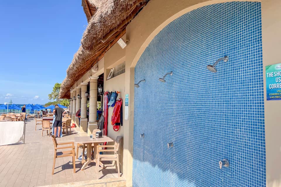 Beachfront resort shop with retail clothing and thatched roof shade