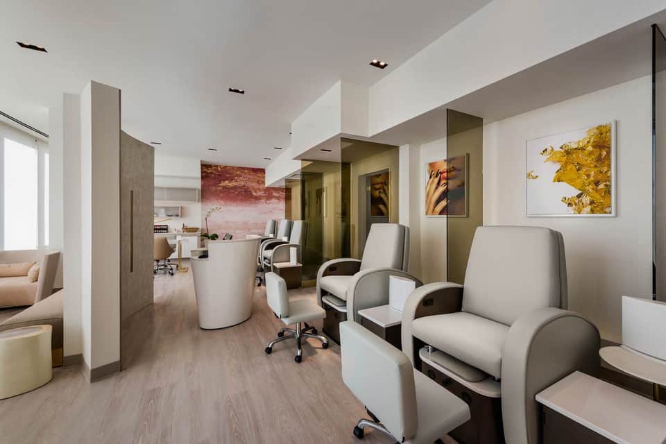Contemporary spa salon interior with white pod chairs and minimalist design elements