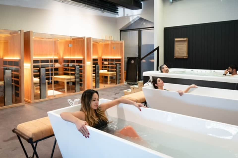 Spa relaxation area with individual soaking tubs and infrared sauna cabins