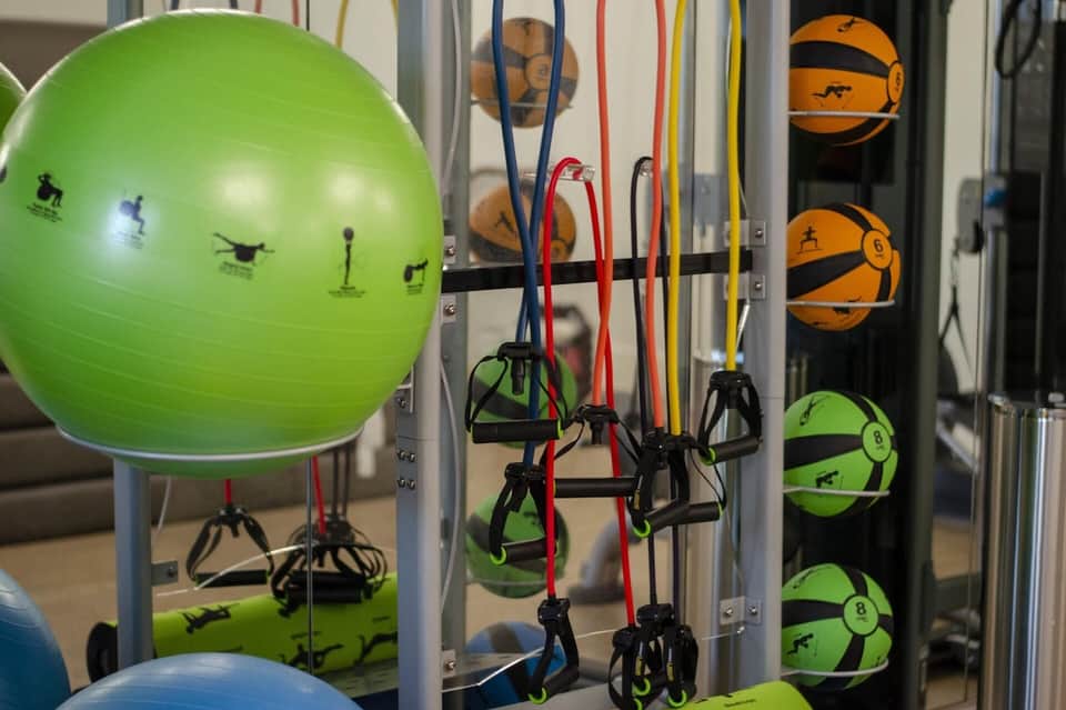 Fitness center storage with exercise equipment including stability ball and resistance bands