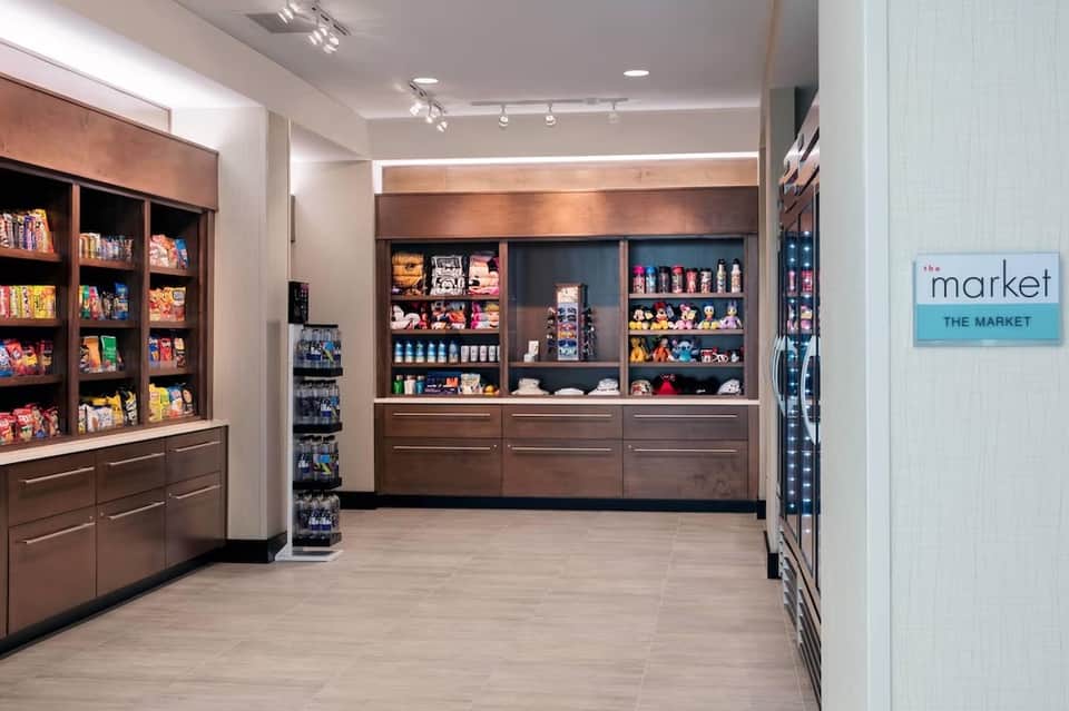 Upscale resort market with dark wood cabinetry, display cases, and retail merchandise