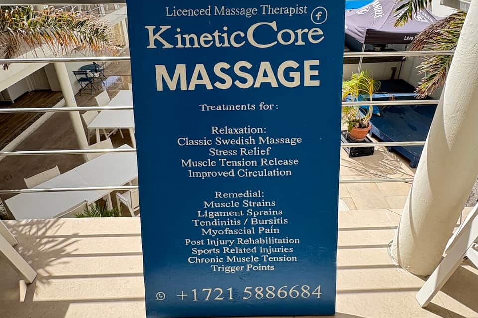 Blue signage advertising KineticCore licensed massage therapy treatments and services