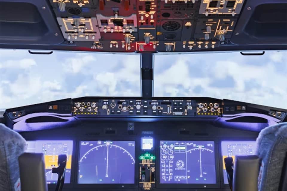 Aircraft cockpit view with instrument panels and sky visible through windscreen