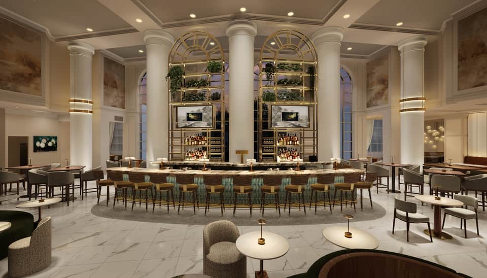 Elegant hotel bar with tall columns, botanical shelving displays, ambient lighting, and sophisticated seating