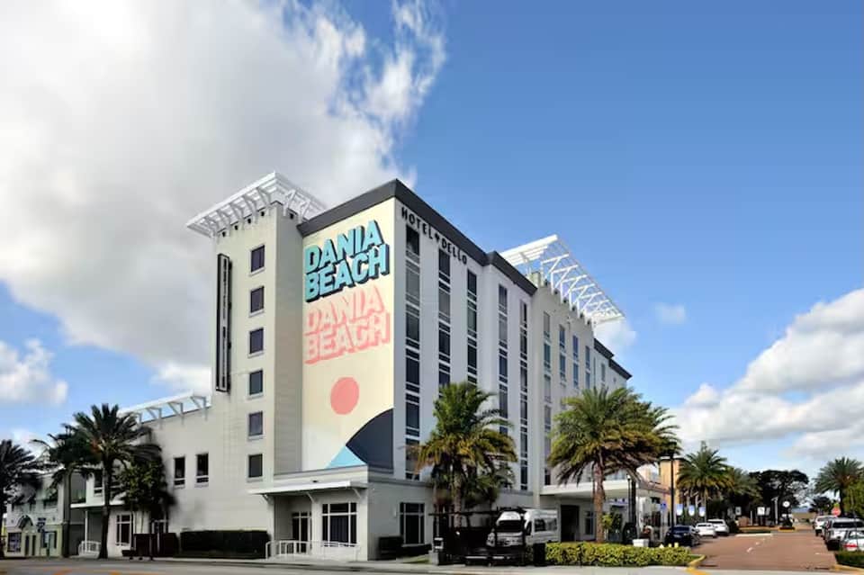 Danda Beach hotel exterior with modern white architecture and palm trees