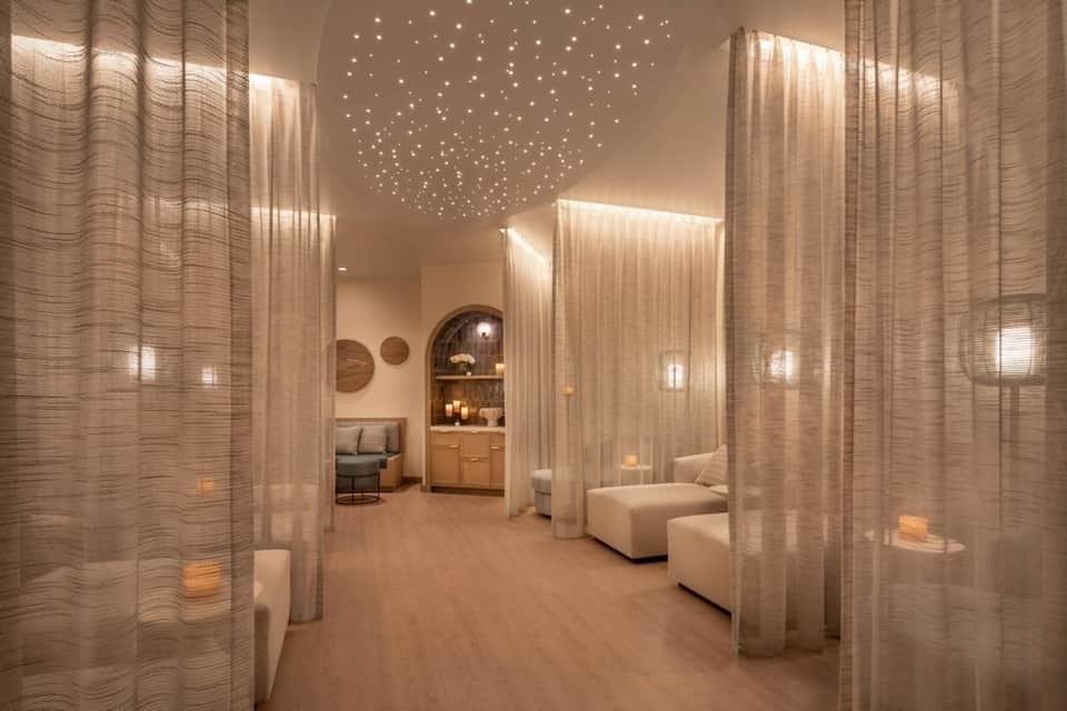 Luxurious spa corridor with sheer curtains, ambient lighting, and modern minimalist design