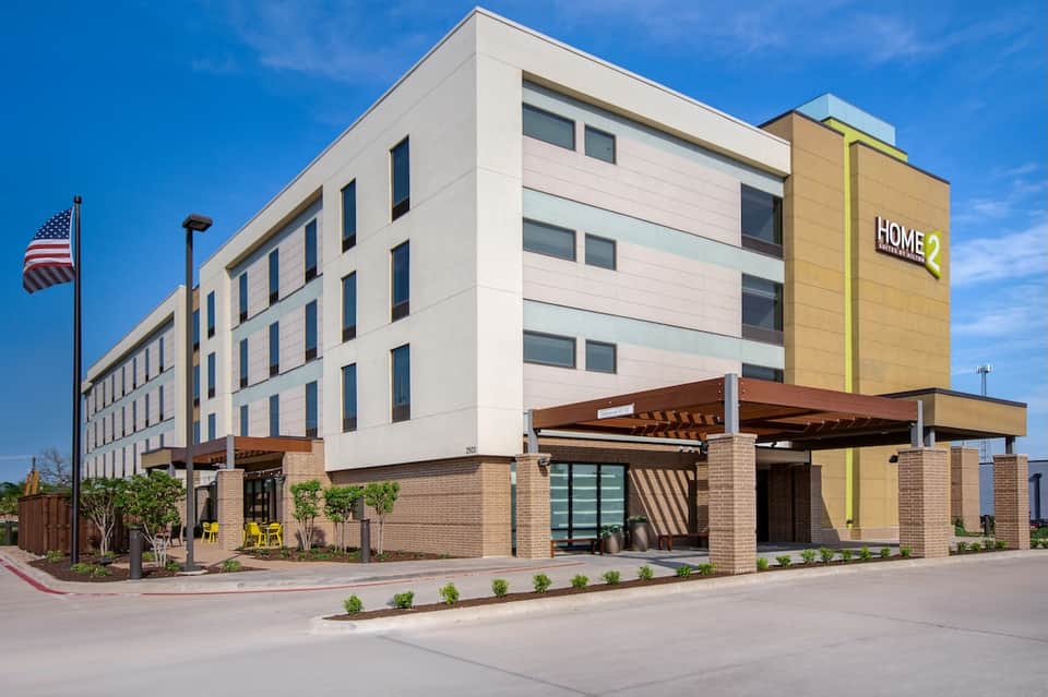 Home2 Suites modern hotel exterior with contemporary architecture and covered entrance area