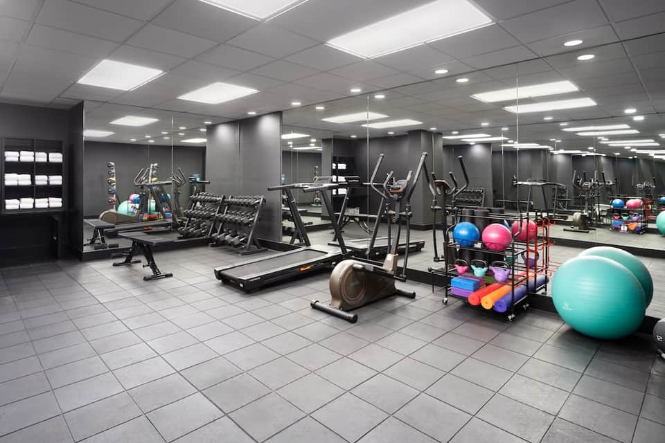 State-of-the-art fitness center with cardio equipment, free weights, and exercise balls