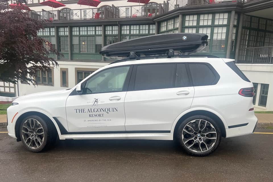 White BMW SUV branded with The Algonquin Resort name parked at luxury Scottish resort entrance