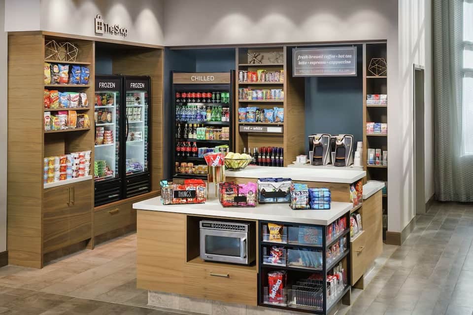 Modern convenience store with refrigerated cases and shelving