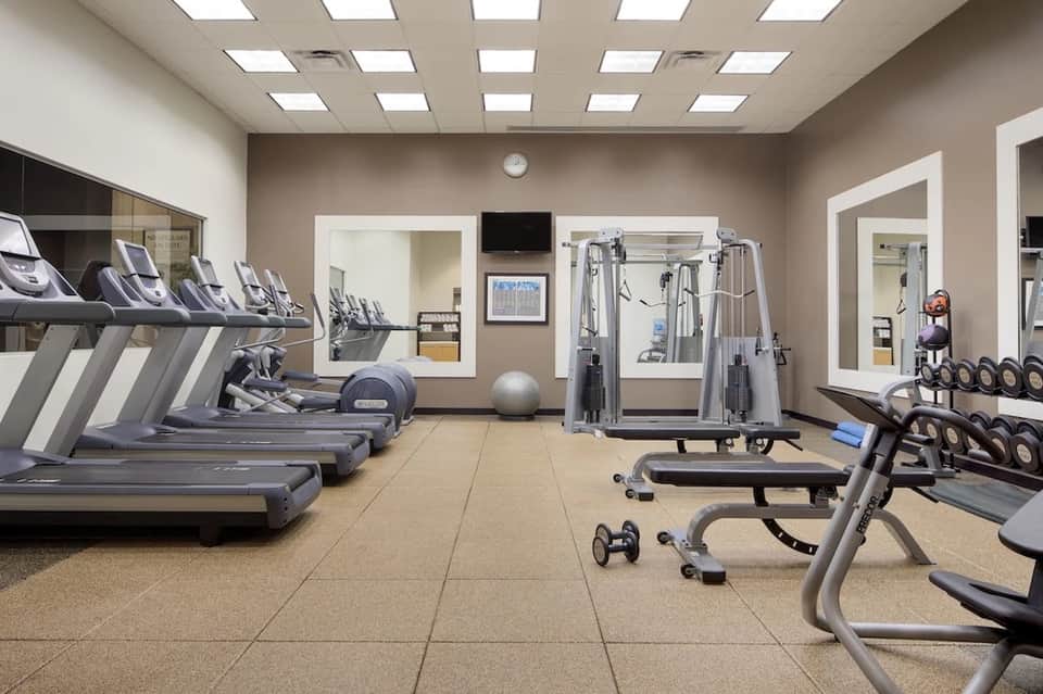 Well-equipped fitness center with treadmills, weights, and exercise machines