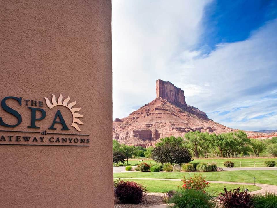 The Spa at Gateway Canyons sign with desert butte formation in background