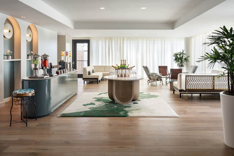 Luxury hotel lobby with reception desk, seating areas, and modern furnishings