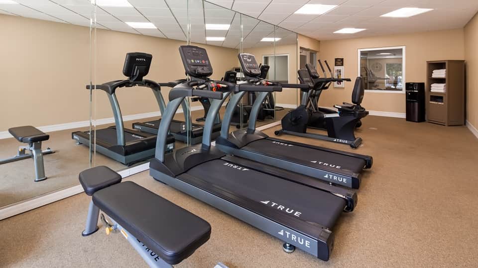 Well-equipped fitness center with treadmills, stationary bikes, and exercise equipment