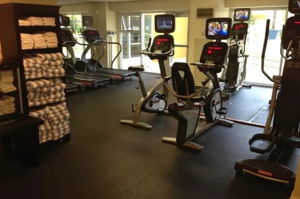 Fitness center with exercise bikes, treadmills, and televisions