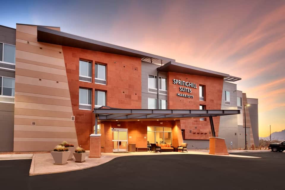 SpringHill Suites Marriott exterior at sunset with modern brick and metal facade
