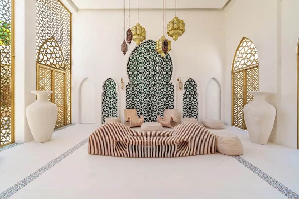 Luxurious spa relaxation room with ornate Moroccan-style architecture and geometric patterned wall feature