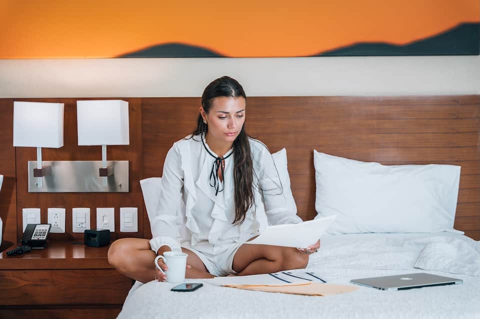 Hotel room workspace with view of mountains and sunset sky