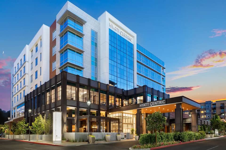Modern Hyatt Centric hotel building at dusk with glass facade and illuminated entrance
