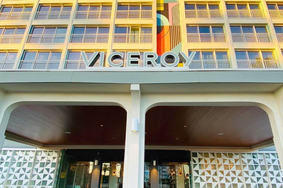Viceroy hotel exterior with yellow façade, balconies, and modern architecture