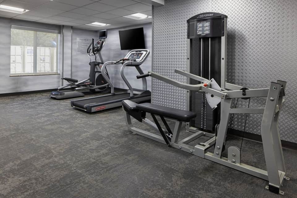 Fitness center with cardio equipment including treadmill and elliptical machine