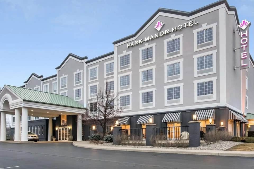 Park Manor Hotel exterior with multiple floors, entrance canopy, and contemporary signage