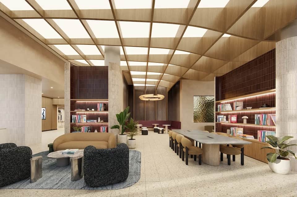Contemporary lobby with curved seating, wooden ceiling, bookshelves, and modern furnishings