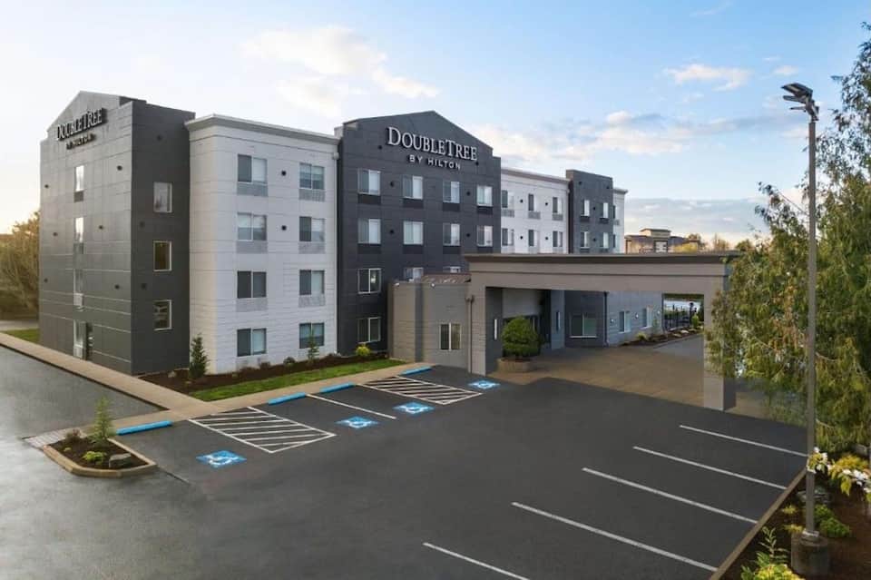 Double Tree by Hilton hotel exterior with modern architecture and accessible parking spaces