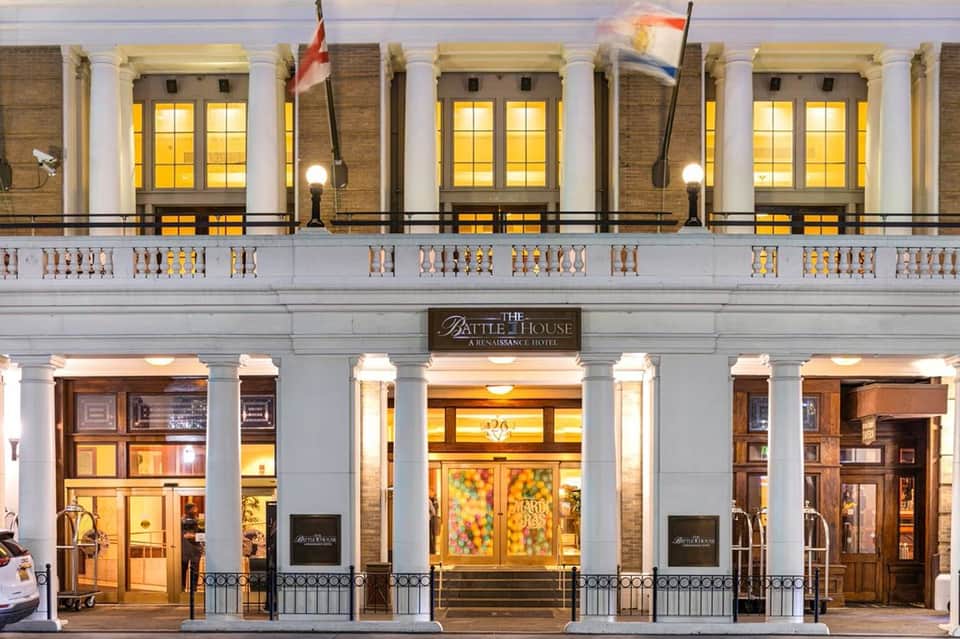 Historic Battle House Renaissance Hotel facade with classical columns, arched windows, and decorative balustrade