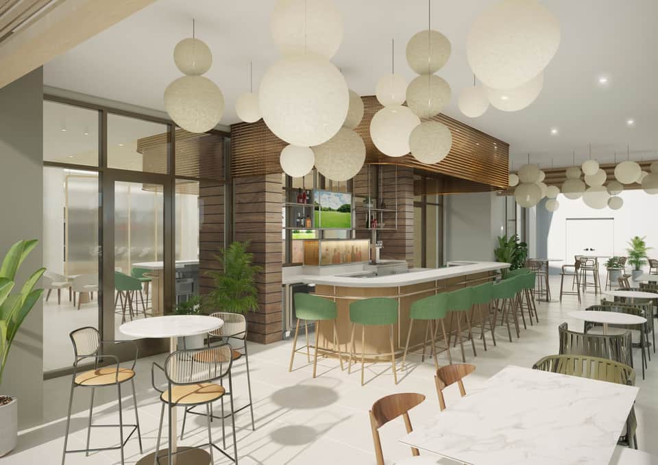 Contemporary hotel lounge with spherical pendant lights, wooden kitchen island, green bar seating, and dining tables
