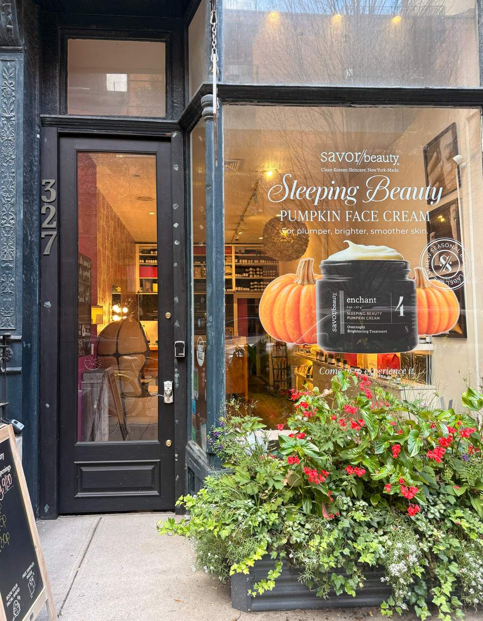 Storefront of savor/beauty boutique in New York featuring pumpkin face cream advertisement