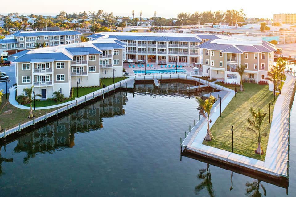 Waterfront residential development with modern buildings and boat docks
