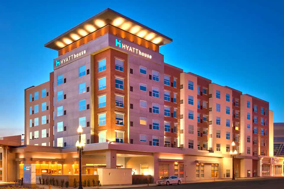 Hyatt House exterior at dusk with illuminated signage and ground-level entrance